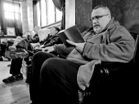 A veteran reads from a book during the 9am meditation session held inside the Veterans Transition House currently housed at the rectory of the now closed St. John church on County Street in New Bedford, MA. A new building is scheduled tol be constructed in 2019.   PHOTO PETER PEREIRA